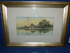 A framed and mounted Watercolour depicting River scene with village and figures fishing,