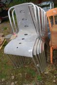 Six metal/Plastic stackable chairs.