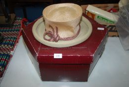 A 'Phillip Treacy' wedding hat and box.