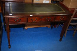 A Mahogany Leather topped three drawer Wiriting table - 4' wide x 2' depth x 30" high.