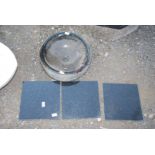 A circular granite black sink - 16" diameter x 6" deep, plus three black 12" square granite tiles.