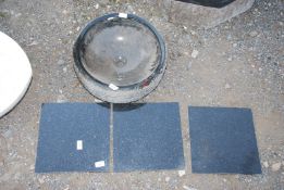 A circular granite black sink - 16" diameter x 6" deep, plus three black 12" square granite tiles.