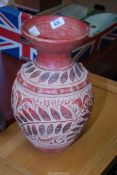 A pottery urn, 15" high.
