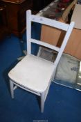A white painted chair.