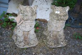 A pair of concrete 'Dogs of Fo' figures, 17½" high.