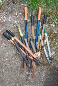 A quantity of garden tools, loppers, and shears.