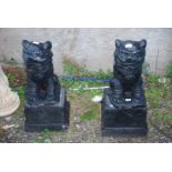 A pair of black painted concrete 'Dogs of Fo' -28" high.