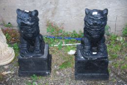 A pair of black painted concrete 'Dogs of Fo' -28" high.
