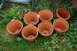 Seven Terracotta pots.
