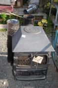 A Multi-burner stove with extra flue 6'' flue pipe and five fire bricks.