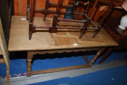 An oak coffee table, 42" wide x 18" deep x 18" high.