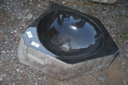 A granite polished sink 20½", (corner to corner) x 6" deep.