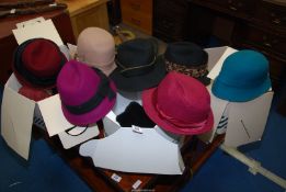 Eleven lady's hats.