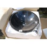 A boxed circular black with gold flecks granite basin - 17" diameter.