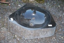 A granite polished sink, 20 ¼ " (corner to corner) x 6" deep.