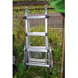 A telescopic multi-purpose ladder with instructions.