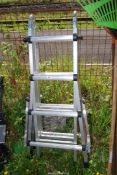 A telescopic multi-purpose ladder with instructions.