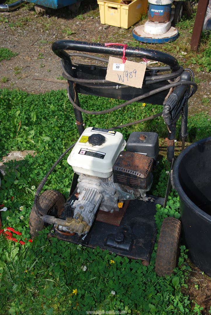 A petrol driven pressure washer.