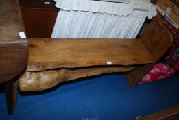 A rustic wood Bench, 46'' long x 29'' high.