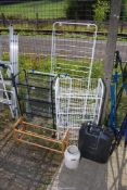 Two vegetable racks, clothes airer, shoe rack, and military water container.