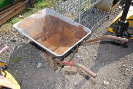 A wheelbarrow with galvanised top with pneumatic tyre - needs attention.
