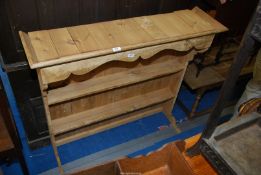 A pine dresser rack with three shelves, 44" wide x 40 1/2" high.