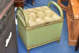 A green Lloyd Loom style dressing/linen stool.