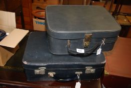 A vintage, blue Antler suitcase and key having cloth interior pocket and a blue Classic vanity case.
