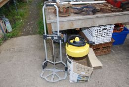 A Kärcher patio cleaner and trolley.