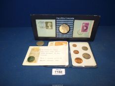 A small quantity of coins to include; George V half Crown, a very worn Victoria half-penny,