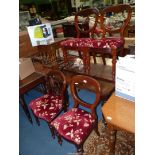 A set of four circa 1900 balloon back Mahogany Dining Chairs standing on turned front legs and