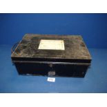 A black metal document tin with carrying handles either side, label to top,