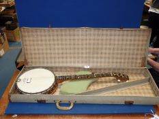 A five string Banjo by Head Master with carry case.