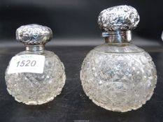 Two silver topped perfume bottles having 'hobnail' cut glass round bases (no stoppers).