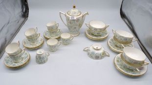 A quantity of Minton 'Vanessa' coffee and dinner ware including nine each coffee cups and saucers,