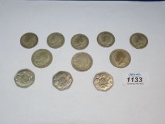 Three George V half crowns, three 1973 Fifty pence pieces and five florins.