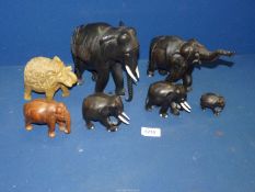 A quantity of ebonised elephants one a/f., one also with broken tusks and an onyx elephant.
