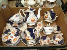 A Gaudy Welsh tea service to include; 12 cups, 15 saucers, teapot, sucrier, milk jug,