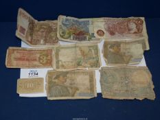 A quantity of foreign notes plus a Bank of England ten pound note a/f.