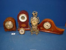 Four clocks; Mercedes, walnut/burr veneer domed clock, etc. Some a/f.