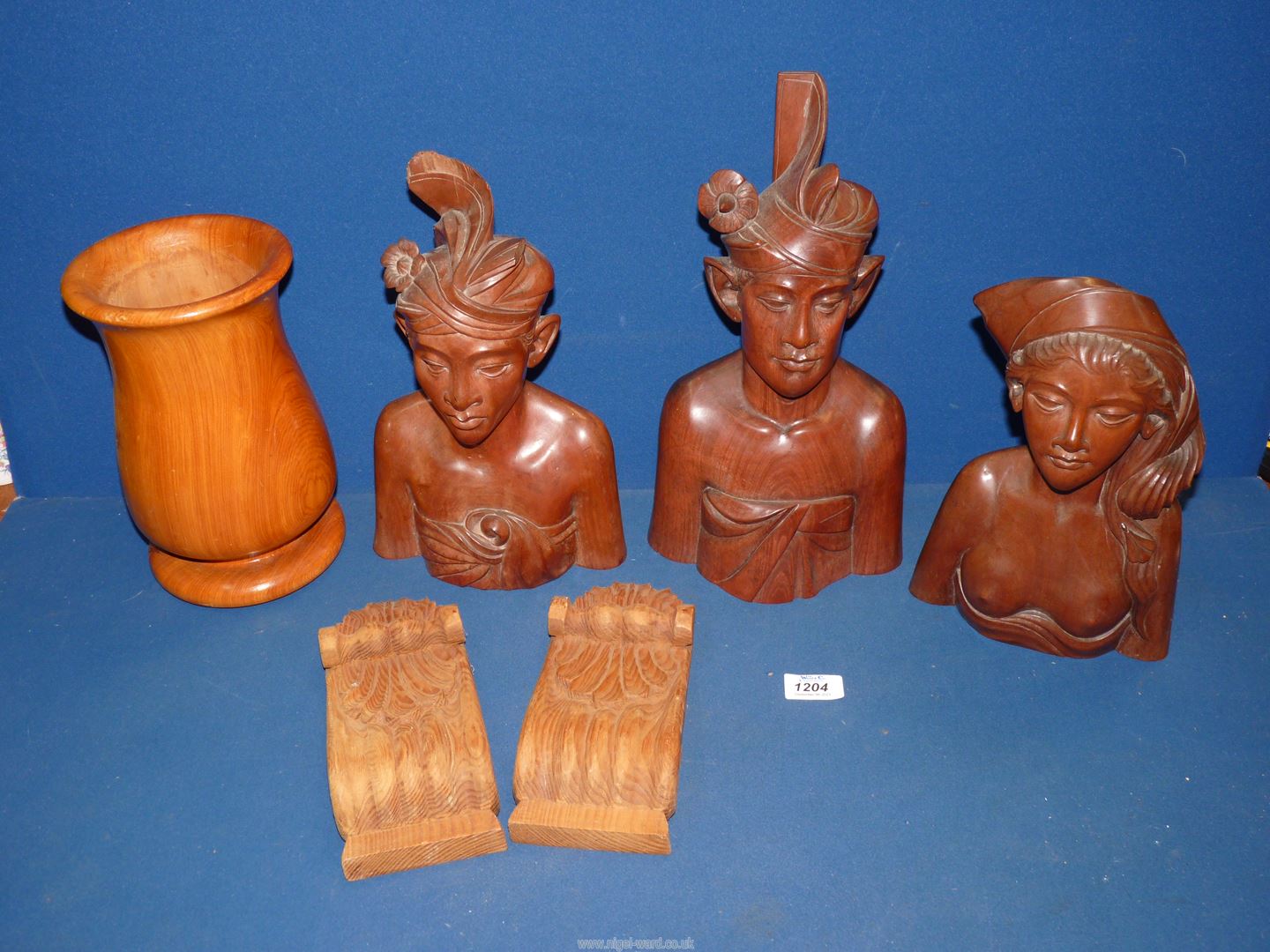 Three Balinese hard wood Busts including; 'Klunghung', 'A. Fatimah', etc.