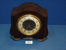 A Smiths Bakelite mantle clock with key, 8 1/2" wide x 7 1/2" tall.