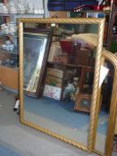 A very large gold framed mirror, 52" x 39 1/2".