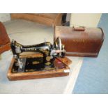 A Singer hand sewing machine.