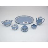A Wedgwood Jasperware miniature tea set for one, includes teapot, water/coffee pot,