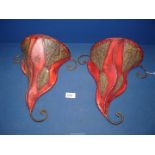 A pair of red leather wall sconces, 12" high x 12" wide.