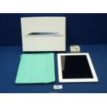 A boxed iPad, (4th generation) Wi-Fi, 16GB, with protective case and earphones, as found.