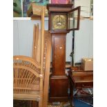 An imposing Oak Long-case Clock having a brass face with cast brass spandrels,