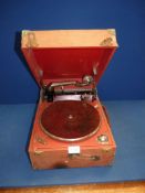 A 'Columbia' wind up gramophone in red case.