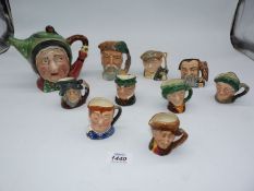 A small quantity of Royal Worcester character jugs to include; 'The Gardener', 'Merlin',